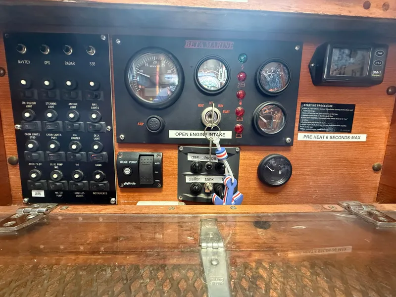 Slide: The Image of Dashboard of a 1980 Rival 32 boat with instruments and switches. - 27