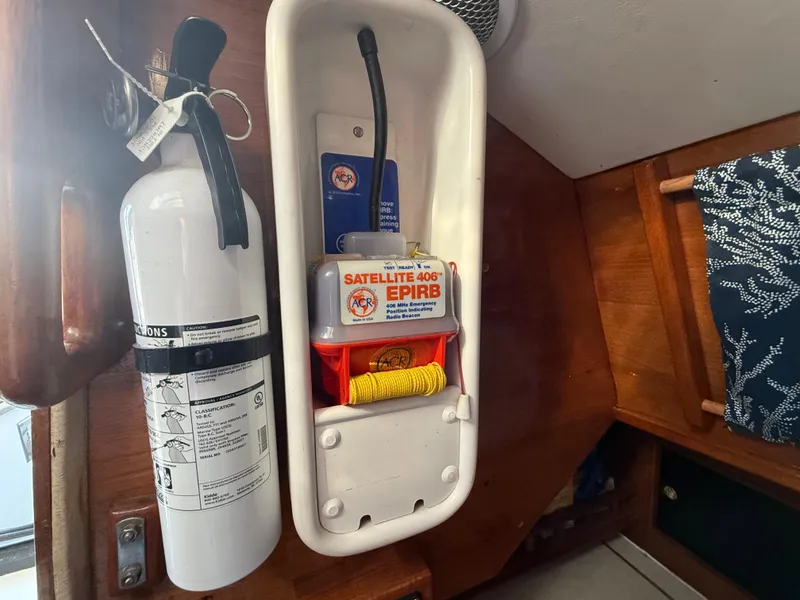 Slide: The Image of Fire extinguisher and EPIRB on Rival 32 boat, year 1980. - 28