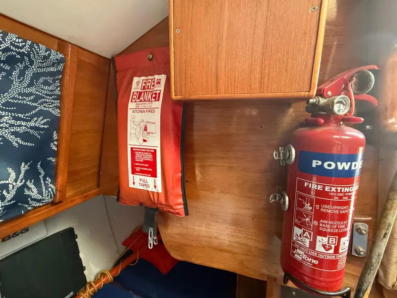 Slide: The Image of Fire extinguisher and blanket in 1980 Rival 32 boat. - 29