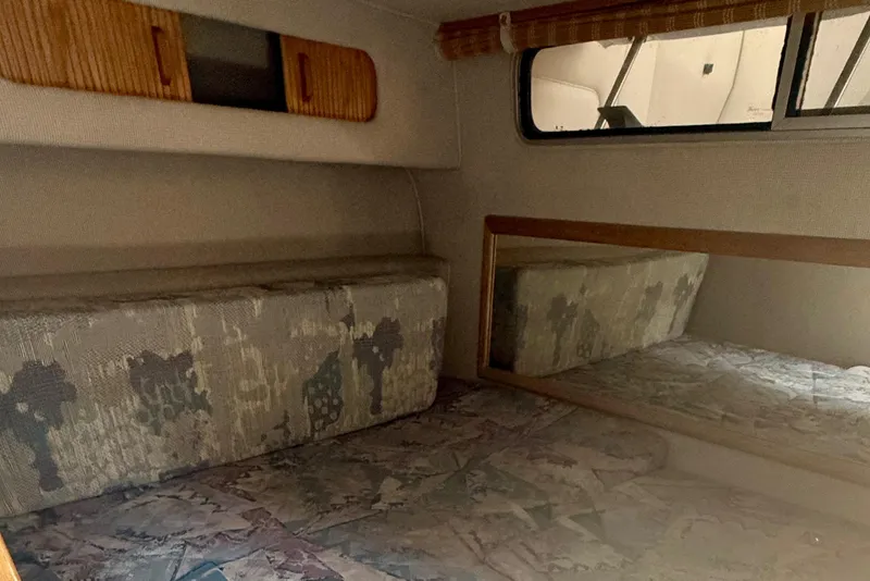 Slide: The Image of Interior cabin of 1992 Sea Ray 290 Sundancer with patterned upholstery and mirror. - 17