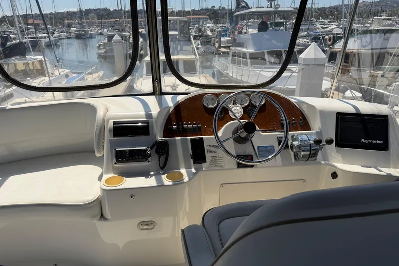 Slide: The Image of 2007 Silverton 33 Convertible yacht helm with steering wheel and navigation equipment. - 10