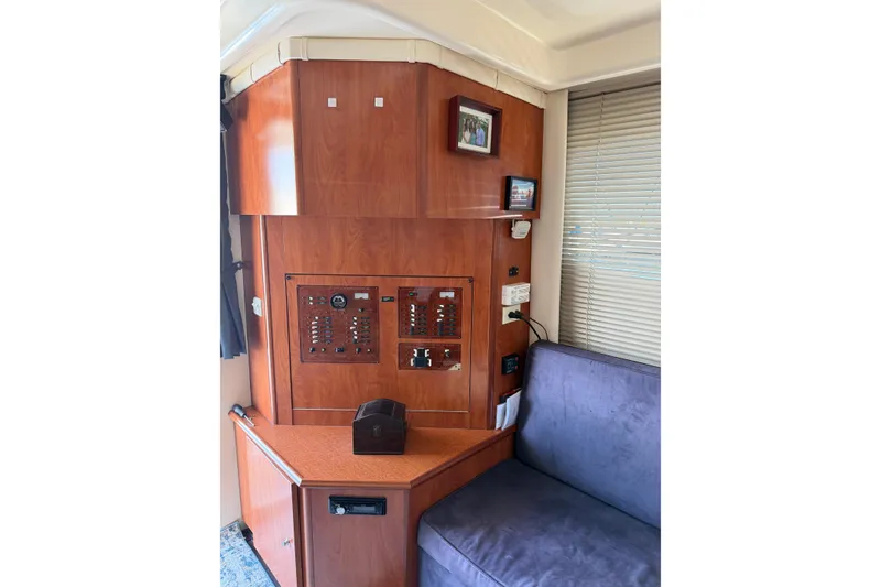 Slide: The Image of Interior of 2007 Silverton 33 Convertible yacht with control panel and seating area. - 21