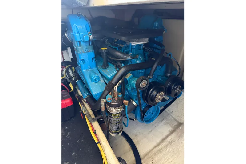 Slide: The Image of Engine of a 2007 Silverton 33 Convertible boat, featuring blue components. - 29