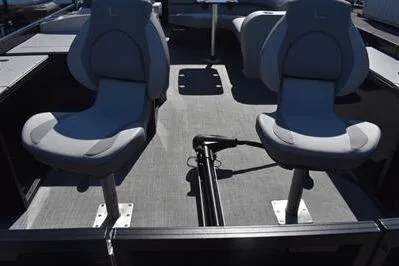 Slide: The Image of 2026 Lowe SF 214 Sport Fish boat interior with two swivel seats and fishing rod holder. - 15