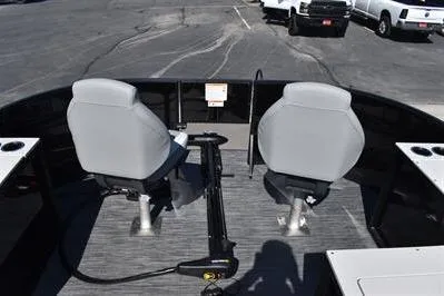Slide: The Image of 2026 Lowe SF 214 Sport Fish boat interior with two gray seats and fishing equipment. - 17