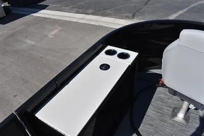Slide: The Image of 2026 Lowe SF 214 Sport Fish boat interior with cup holders and seating. - 18