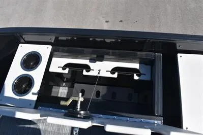 Slide: The Image of 2026 Lowe SF 214 Sport Fish boat interior with rod holders and storage compartments. - 21