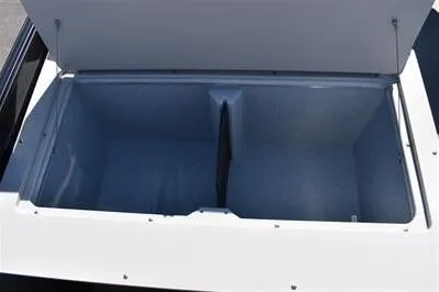 Slide: The Image of Open storage compartment on a 2026 Lowe SF 214 Sport Fish boat. - 23
