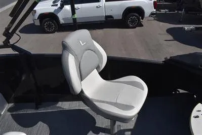Slide: The Image of 2026 Lowe SF 214 Sport Fish boat seat, featuring a sleek, modern design in a marina setting. - 29