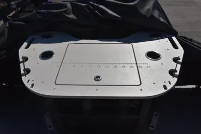 Slide: The Image of 2026 Lowe SF 214 Sport Fish boat deck with cup holders and measurement markings. - 30