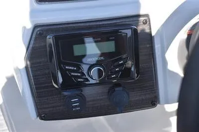 Slide: The Image of 2026 Lowe SF 214 Sport Fish boat dashboard with stereo system and controls. - 31