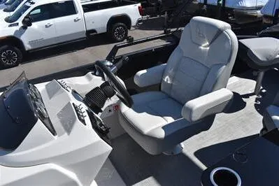 Slide: The Image of 2026 Lowe SF 214 Sport Fish boat interior with comfortable captain's chair and steering console. - 33