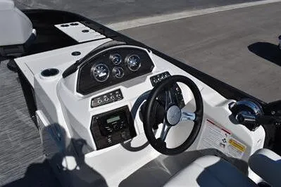 Slide: The Image of 2026 Lowe SF 214 Sport Fish boat dashboard with steering wheel and instrument panel. - 34