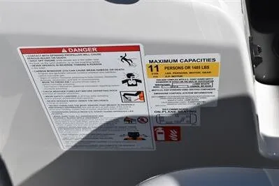 Slide: The Image of Warning and capacity labels on 2026 Lowe SF 214 Sport Fish boat. - 39