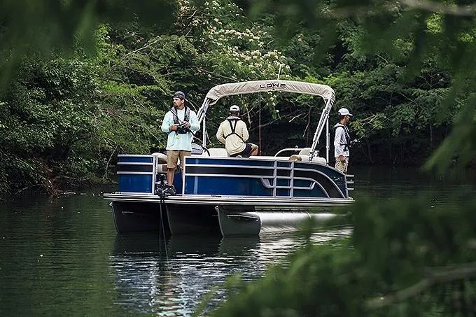 Slide: The Image of Manufacturer Provided Image: 2025 Lowe SF 214 pontoon boat with people fishing on a serene lake. - 43