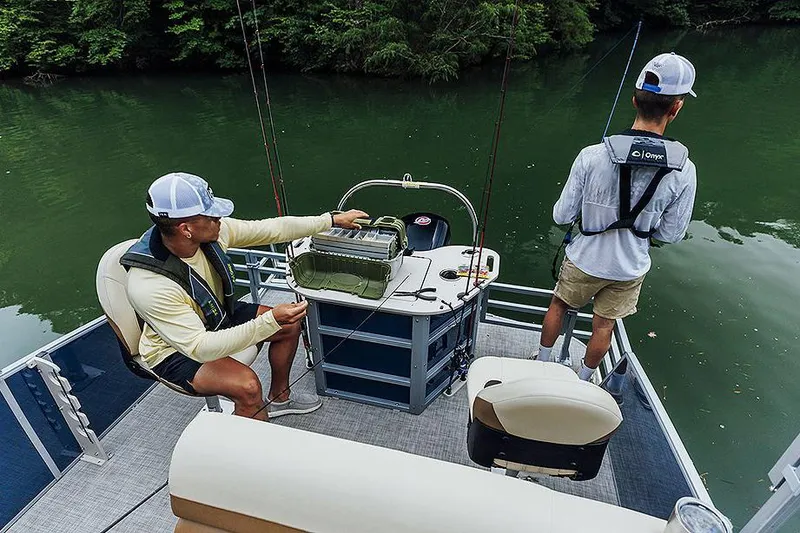 Slide: The Image of Manufacturer Provided Image: Two people fishing on a 2025 Lowe SF 214 boat in a serene lake. - 46