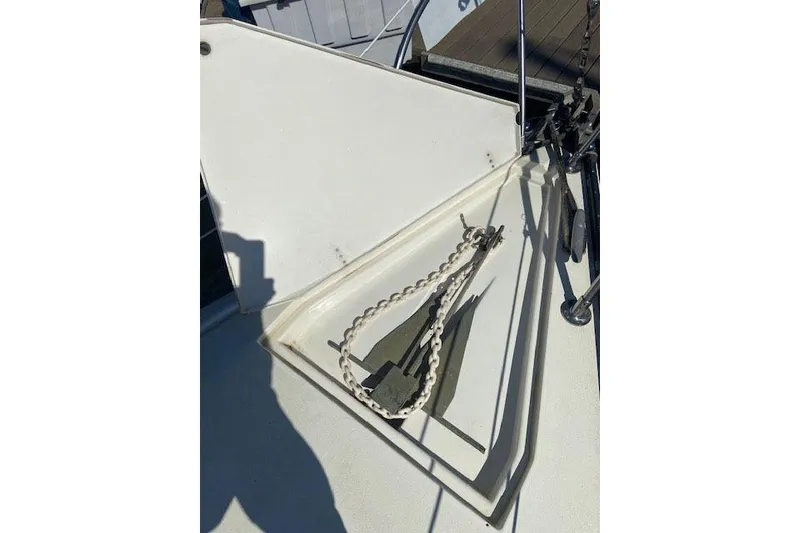 Slide: The Image of Anchor and chain on a 1977 C&C 29 sailboat deck. - 12