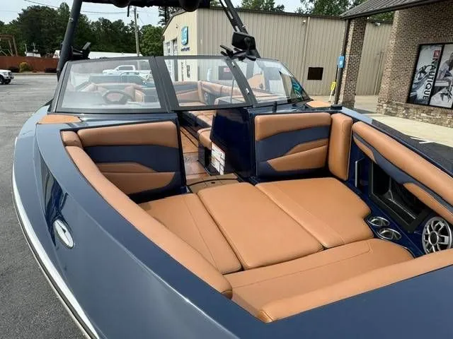 Slide: The Image of 2023 Axis Wake Research T250 boat with luxurious interior seating. - 13