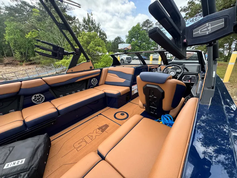 Slide: The Image of Interior of 2023 Axis Wake Research T250 boat with brown seating. - 17