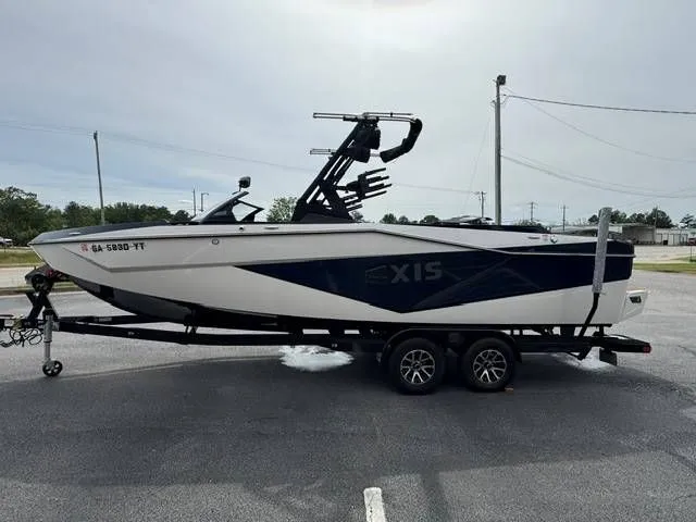 Slide: The Image of 2023 Axis Wake Research T250 boat on trailer, side view. - 3