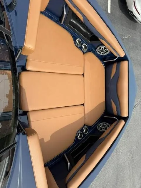 Slide: The Image of Interior of a 2023 Axis Wake Research T250 boat with beige seating. - 4