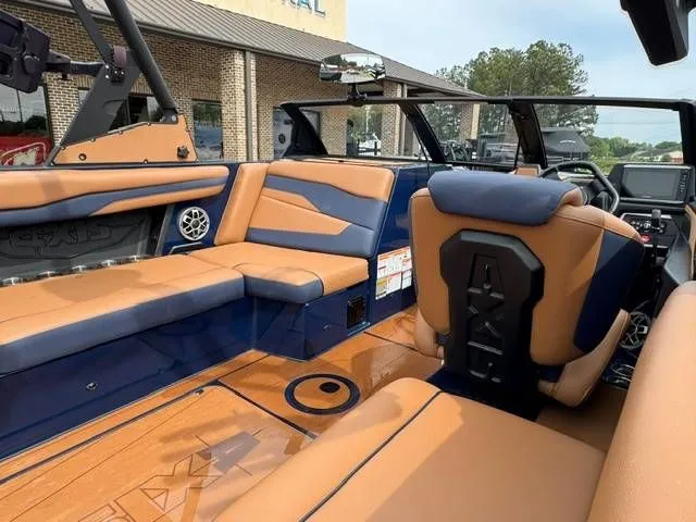 Slide: The Image of Interior of a 2023 Axis Wake Research T250 boat with luxurious seating. - 7