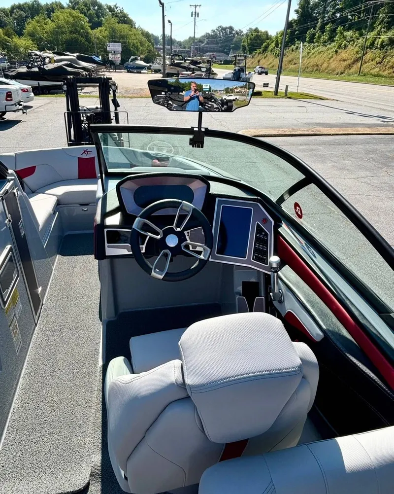 Slide: The Image of Interior of a 2022 MasterCraft XT23 boat with modern helm. - 10