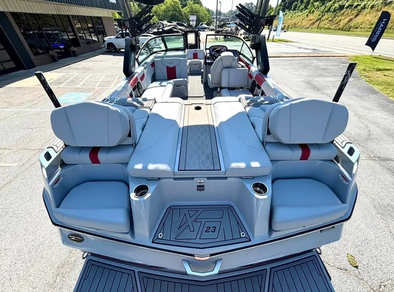 Slide: The Image of 2022 MasterCraft XT23 boat with luxurious interior and seating. - 13