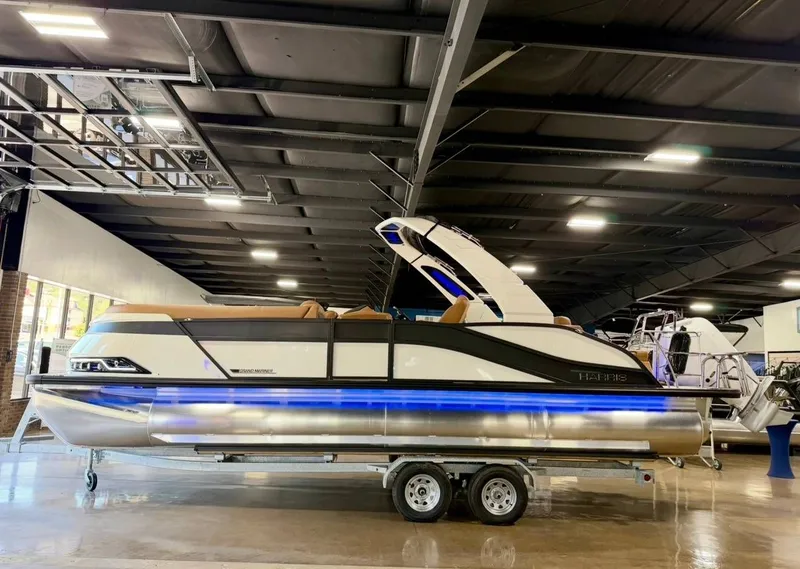 The Image of 2026 Harris Grand Mariner 250 pontoon boat in showroom. - 1