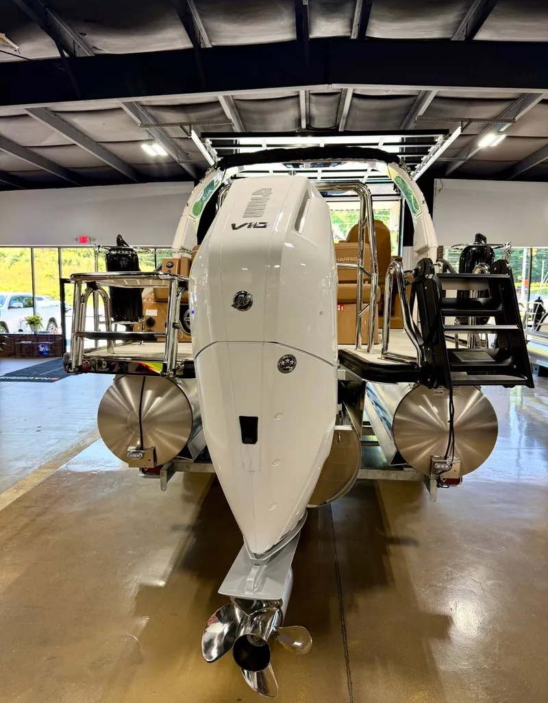 Slide: The Image of 2026 Harris Grand Mariner 250 with powerful outboard motor. - 14