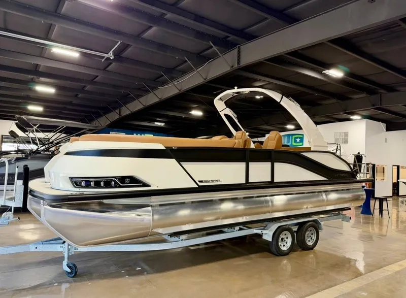Slide: The Image of 2026 Harris Grand Mariner 250 pontoon boat in showroom. - 3