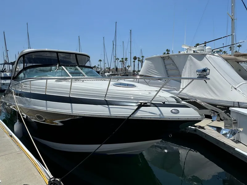 Slide: The Image of 2018 Crownline 350 SY yacht docked at marina under clear blue sky. - 11