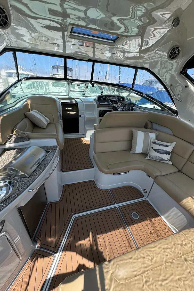 Slide: The Image of Luxurious 2018 Crownline 350 SY yacht interior with plush seating and modern amenities. - 21