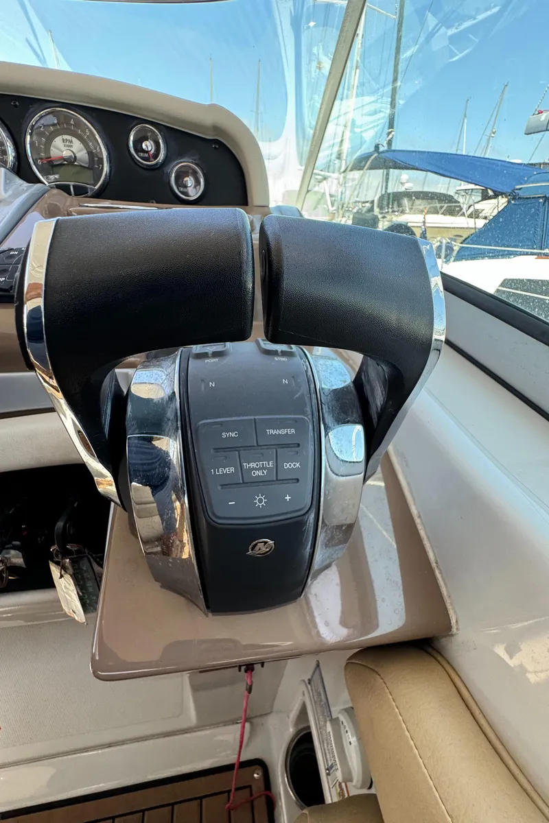 Slide: The Image of Throttle controls of a 2018 Crownline 350 SY boat, featuring a sleek design. - 29