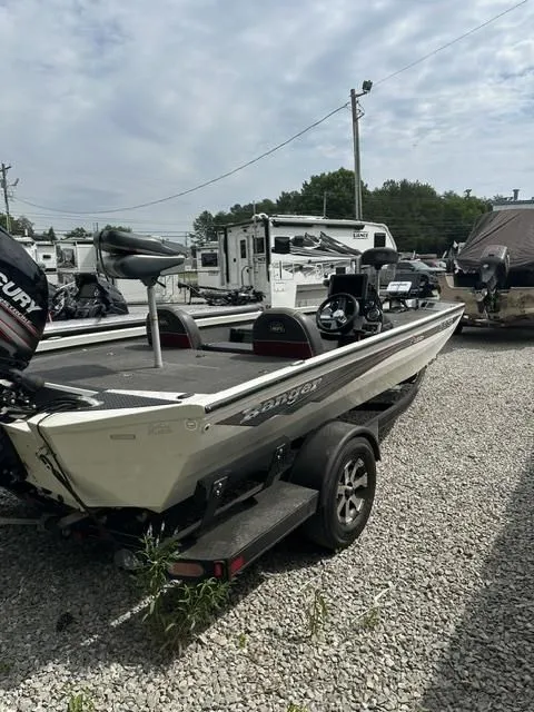 The Image of 2018 Ranger Tournament RT198P boat parked on gravel lot. - 1