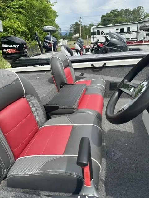 Slide: The Image of Interior of a 2018 Ranger Tournament RT198P boat with red and gray seats. - 10