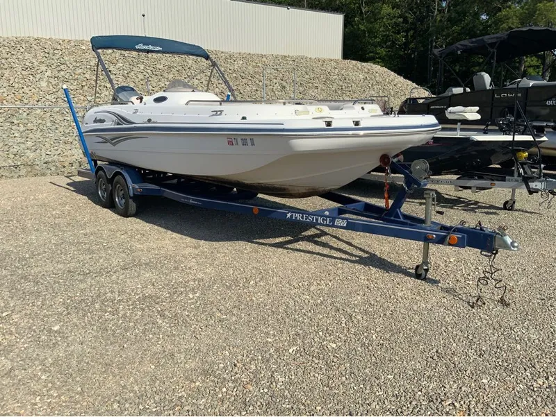 The Image of 2006 Hurricane GS232 boat parked on trailer outdoors. - 1