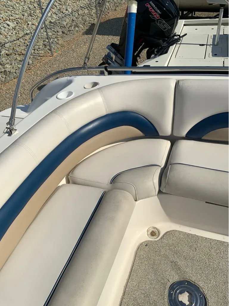 Slide: The Image of Interior of a 2006 Hurricane GS232 boat with cushioned seating. - 10