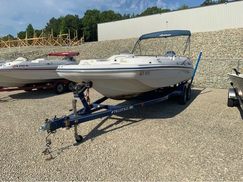 Slide: The Image of 2006 Hurricane GS232 boat parked on trailer outdoors. - 12
