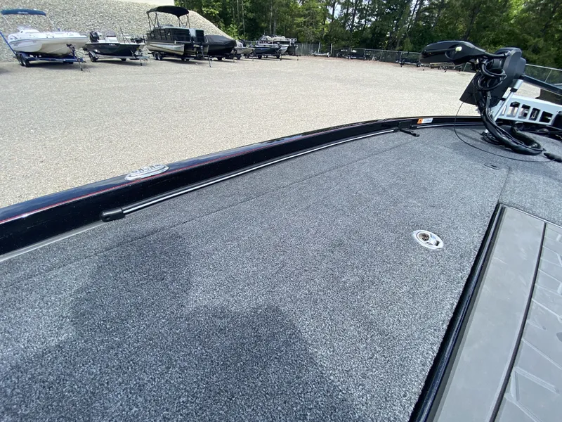 Slide: The Image of 2026 Ranger Z Comanche Z521R boat deck at a marina. - 10