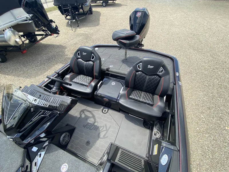 Slide: The Image of 2026 Ranger Z Comanche Z521R boat interior with luxurious seating. - 11