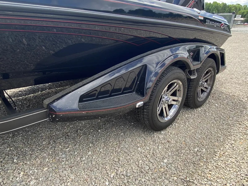 Slide: The Image of Ranger Z Comanche Z521R 2026 boat trailer on gravel. - 18