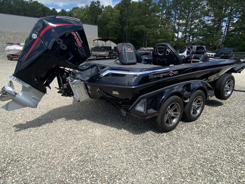 Slide: The Image of 2026 Ranger Z Comanche Z521R boat on gravel lot, side view. - 21