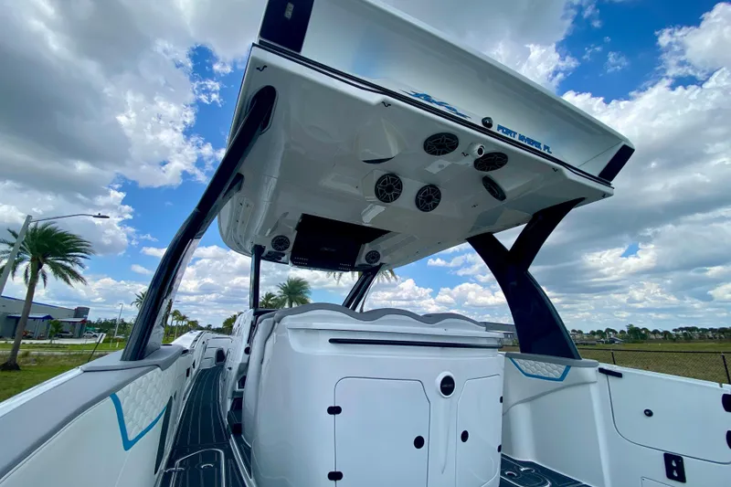 Slide: The Image of 2024 MTI V50 boat cockpit with advanced navigation system and sleek design. - 14
