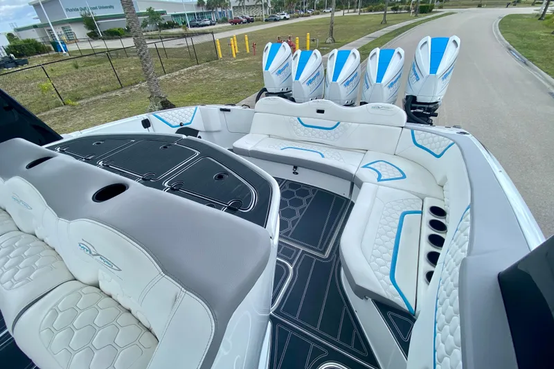 Slide: The Image of 2024 MTI V50 boat interior with hexagonal patterns and sleek design under a blue sky. - 18