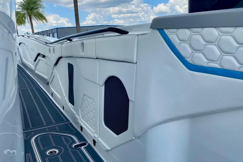 Slide: The Image of 2024 MTI V50 boat cabin entrance with sleek interior design and modern amenities. - 19