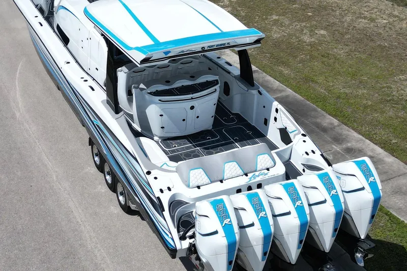 Slide: The Image of 2024 MTI V50 boat with multiple engines, sleek design, and spacious deck. - 4