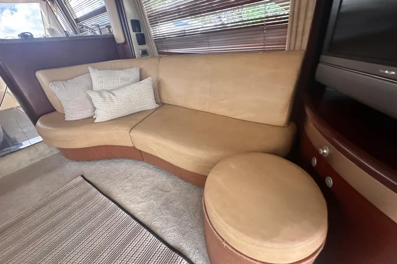Slide: The Image of Luxurious interior of 2006 Sea Ray 58 Sedan Bridge with beige leather seating. - 18