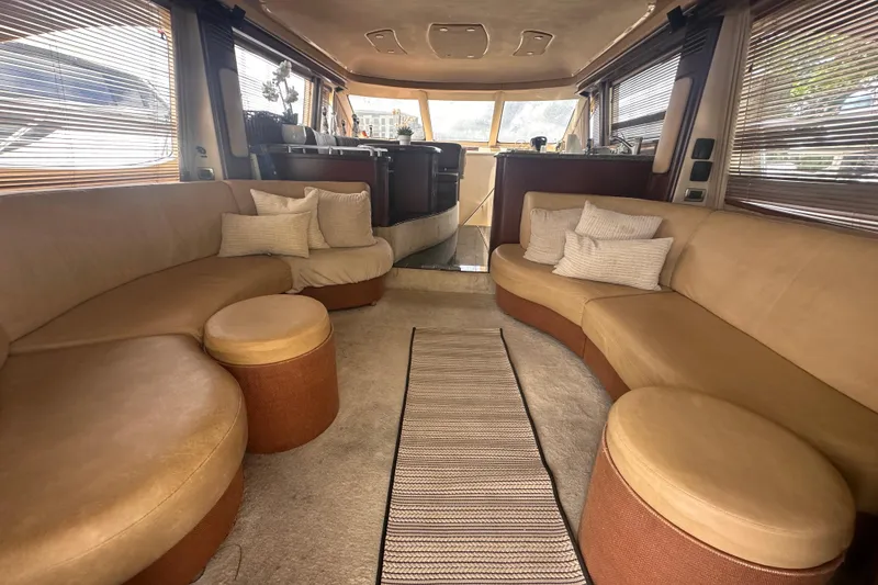 Slide: The Image of Luxurious interior of 2006 Sea Ray 58 Sedan Bridge yacht with plush seating and elegant decor. - 19