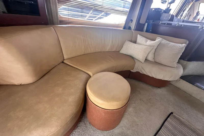 Slide: The Image of Luxurious interior of 2006 Sea Ray 58 Sedan Bridge with beige leather seating and cushions. - 20